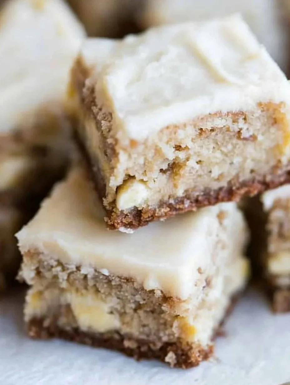 A close-up of a delicious dessert, a piece of cake with white icing.