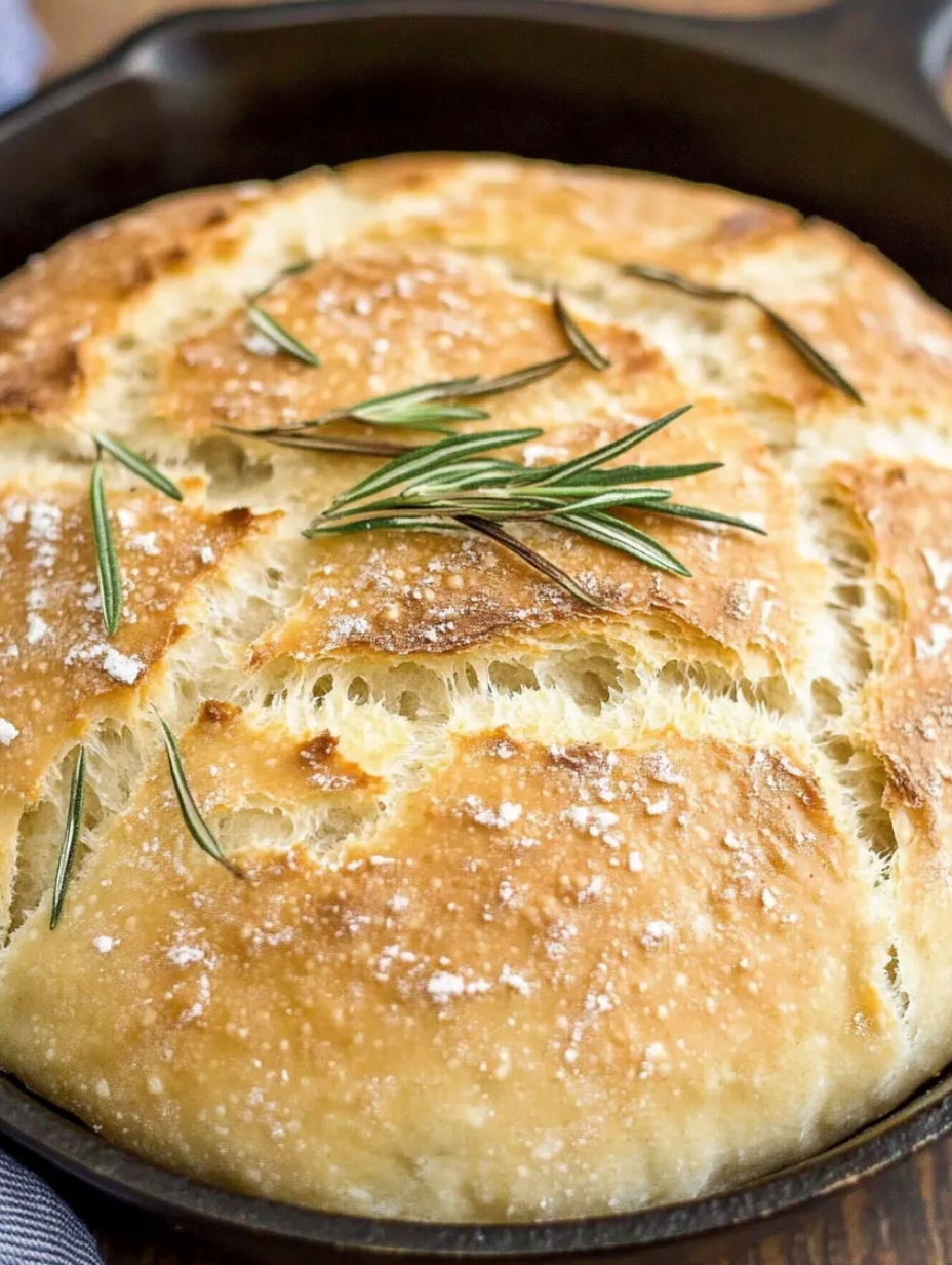 A baked bread with herbs on top.