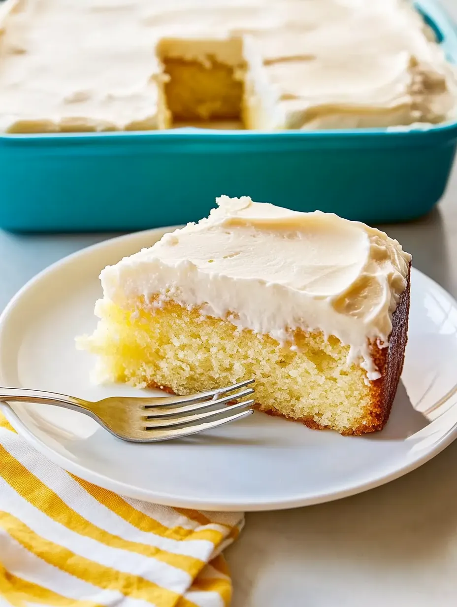 A slice of cake on a plate with a fork.