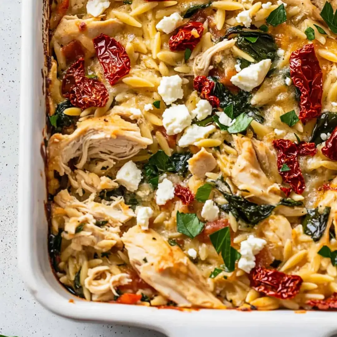 A delicious pasta dish with chicken, tomatoes, and cheese.
