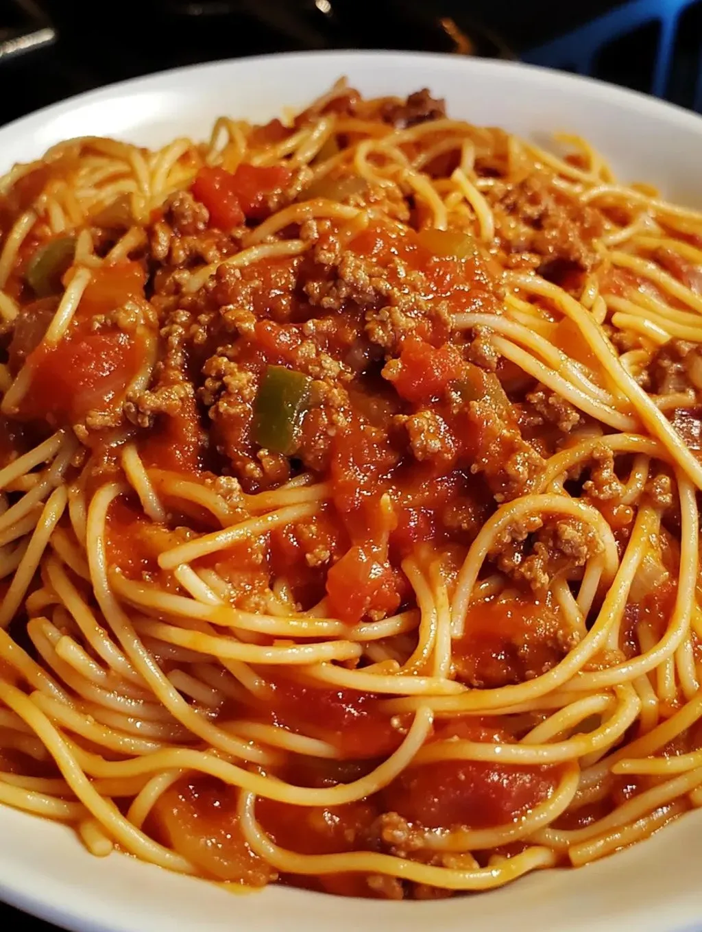 A delicious bowl of spaghetti with meat sauce.