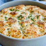 A bowl of food with a white plate on top of it.