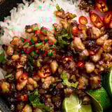 A hearty bowl with fluffy rice and caramel pork.