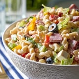 A bowl of pasta salad with vegetables.