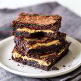 A plate of chocolate cake with peanut butter and caramel.