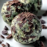 Two chocolate covered balls of food.